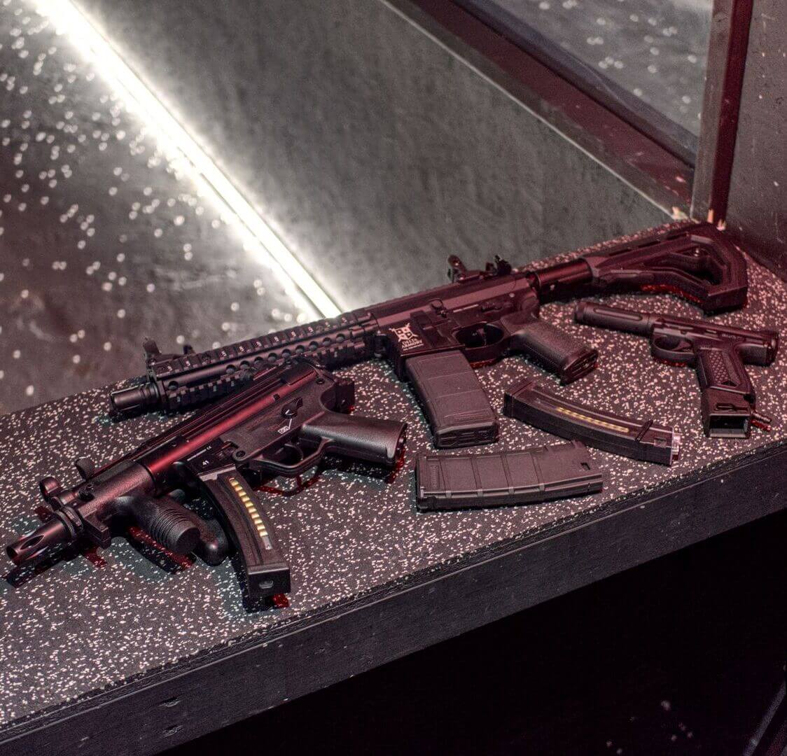 Weapon and ammunition o counter top at shooters range.