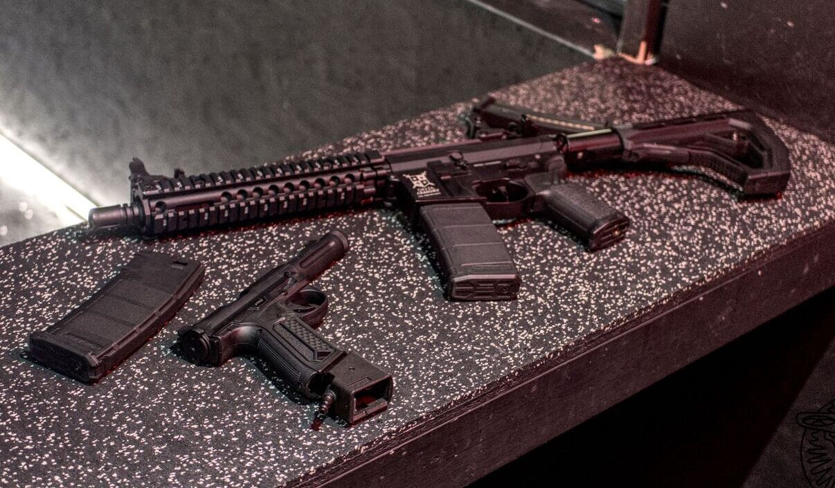 Weapon and accessories on a reflective surface